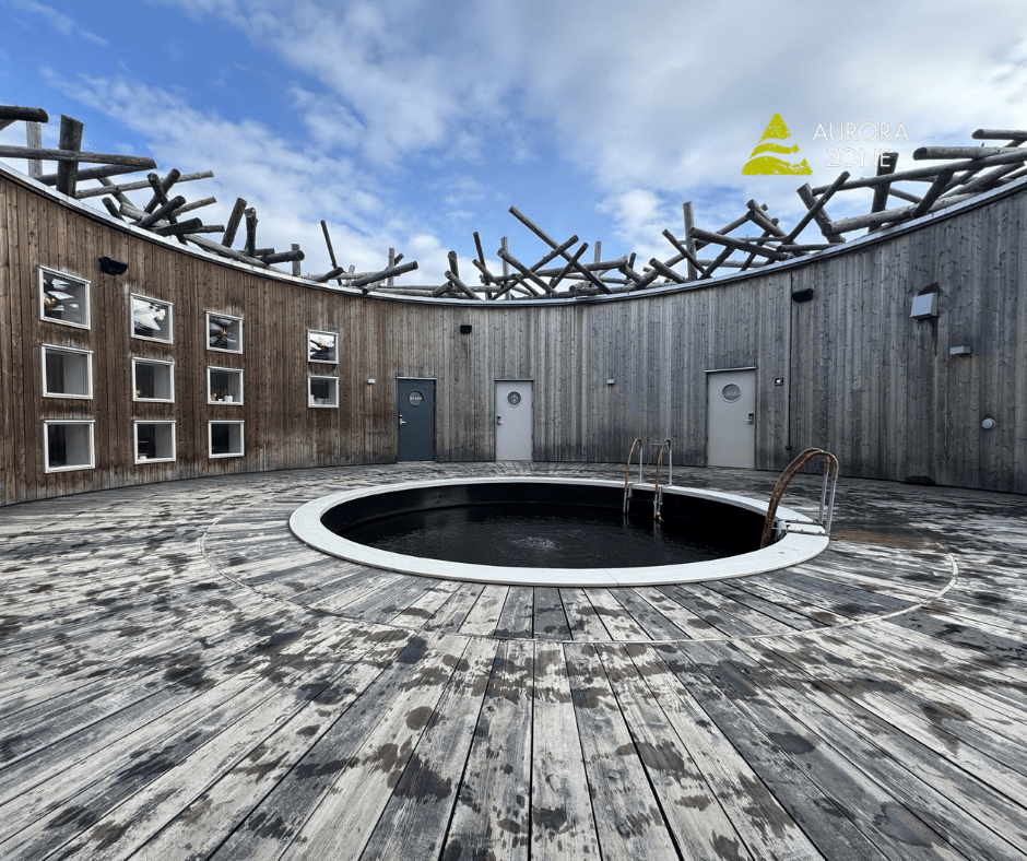 Arctic Bath in Swedish Lapland with a circle pool in the middle of a decked area.